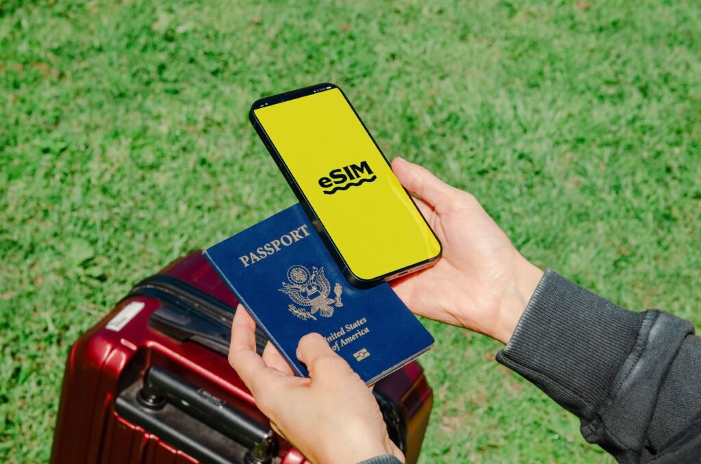 https://www.pexels.com/photo/close-up-of-a-person-holding-a-passport-and-a-smartphone-20805602/